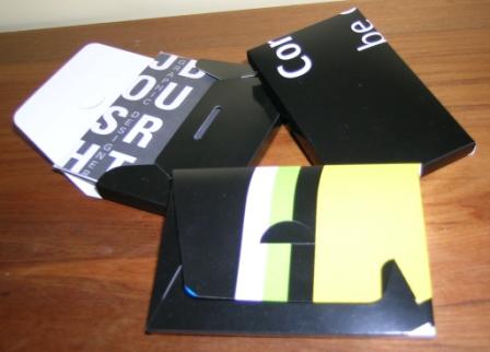 Recyled business card carry boxes made from Adshel posters.